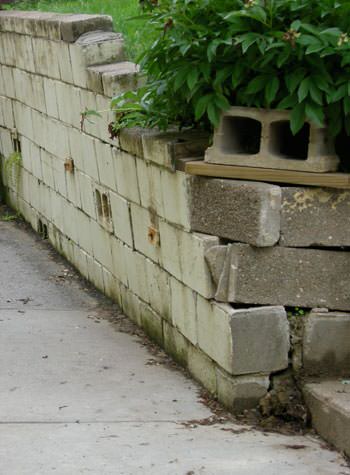 collapsing retaining wall with severe damage in Glendale