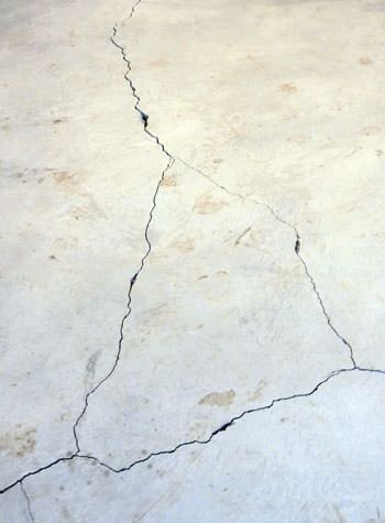 severely cracked, heaving slab floors in a home in Garden Grove