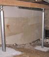 A system of crawl space support posts adding structural support to a crawl space in Oceanside
