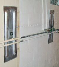 A foundation wall anchor system used to repair a basement wall in Glendale