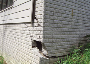 A severely damaged foundation wall in Bakersfield