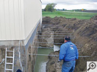 Drilling the hole in the foundation wall for street creep repairs in Huntington Beach