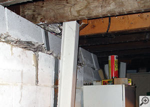A failing foundation wall and i-beam support in a Los Angeles home